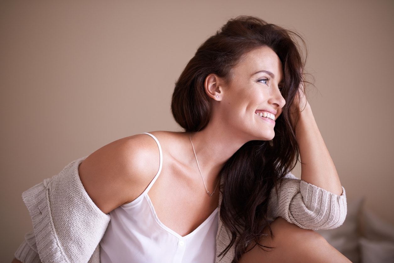 Shot of a beautiful woman relaxing at home | Botox